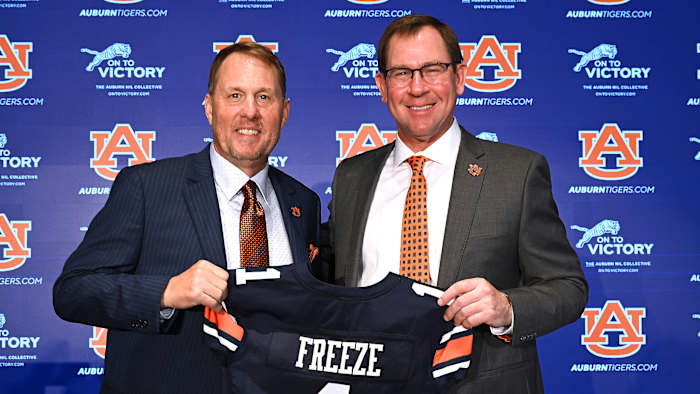 Auburn’s Hugh Freeze and AD John Cohen pose together